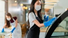 attractive-positive-young-asian-woman-staff-uniform-apron-spraying-detergent-alcohol-counter-product-cabinet-wiping-it-with-soft-cloth-when-disinfecting-cafe-ther-morning-safe-clean