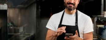 chef-cooking-kitchen-while-wearing-professional-attire