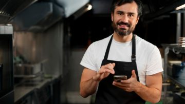 chef-cooking-kitchen-while-wearing-professional-attire