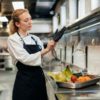 female-chef-putting-glove-kitchen