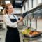 female-chef-putting-glove-kitchen